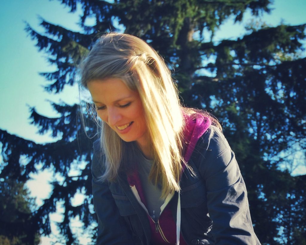 Image of a smiling woman with long straight blond hair.