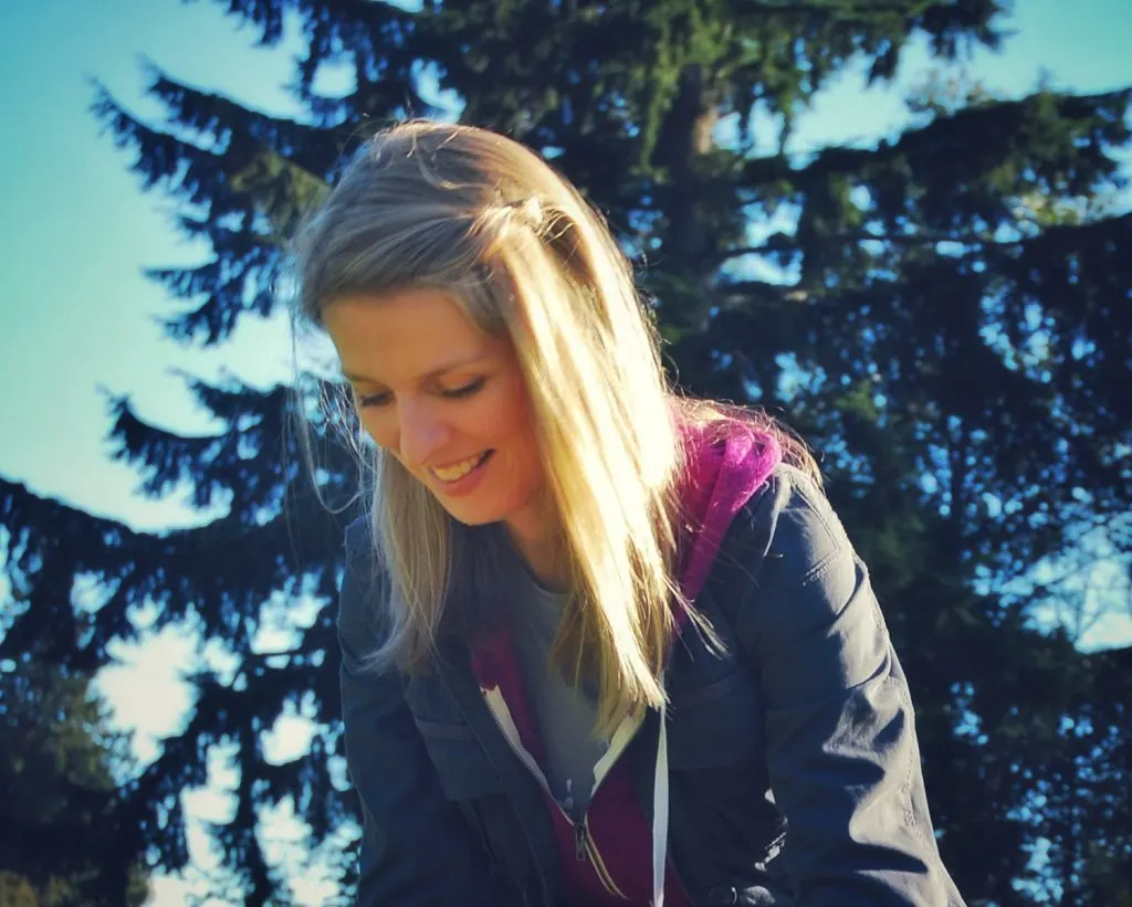 Image of a smiling woman with long straight blond hair.