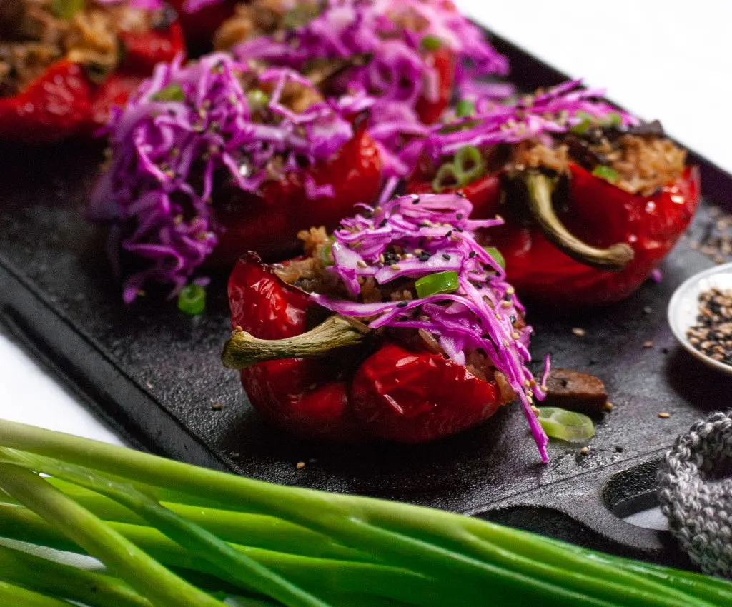 Roasted Peppers Stuffed with Sesame Ginger Mushrooms, Tofu and Rice, Topped with Red Cabbage Slaw