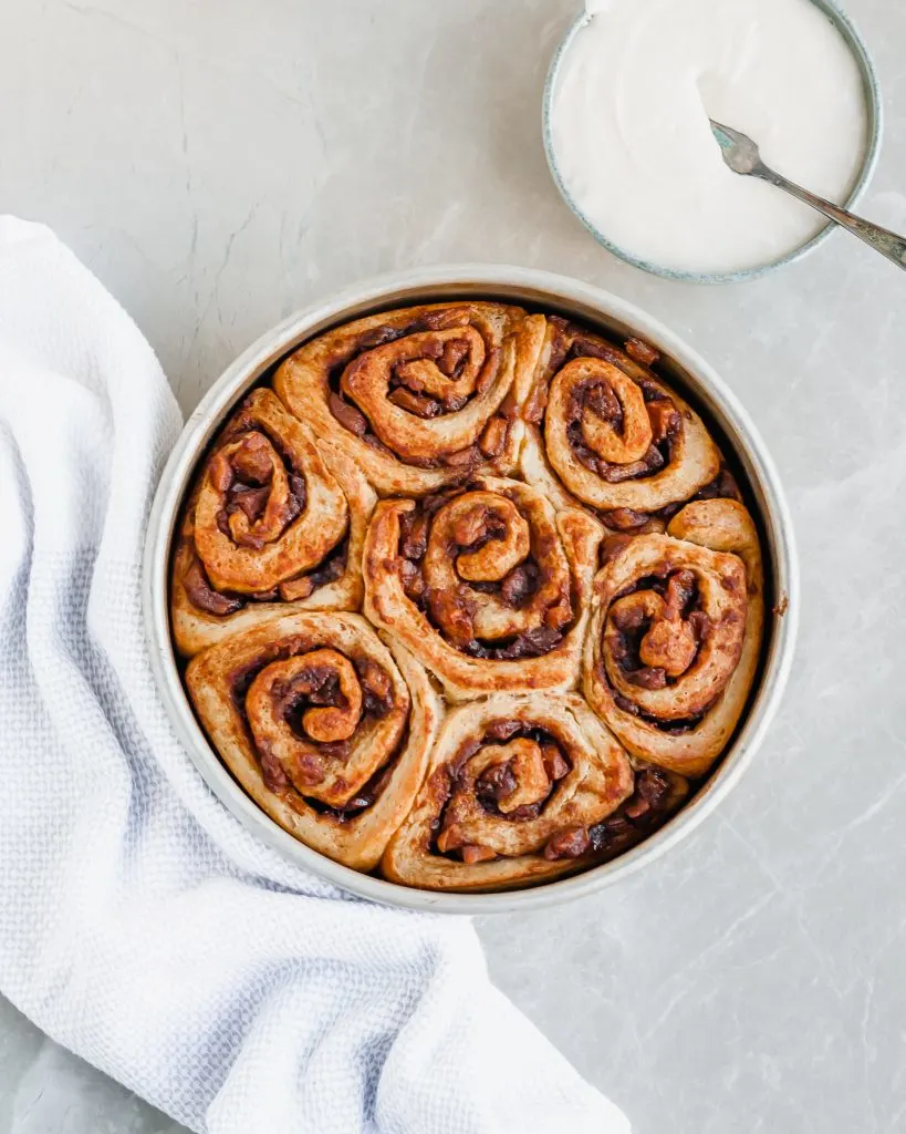 Apple Pie Cinnamon about to be topped with vanilla glaze