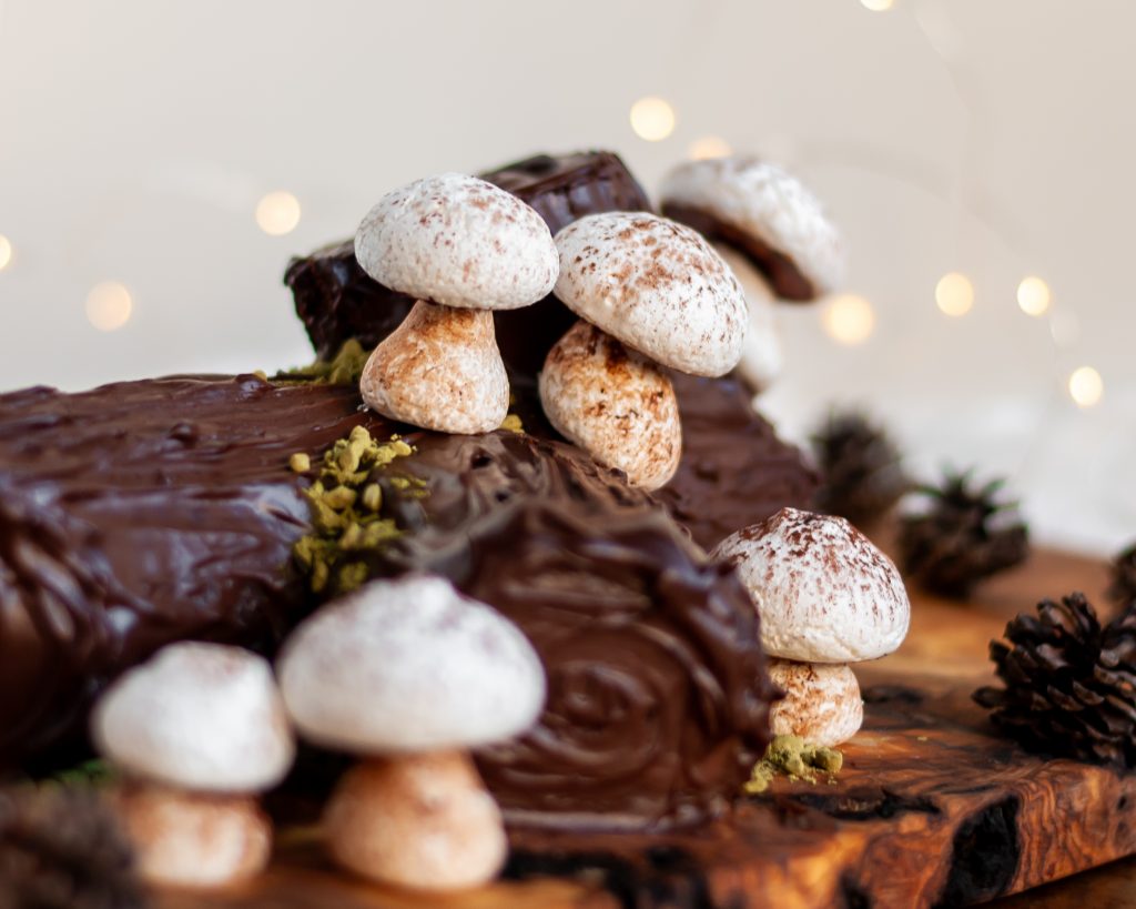 Vegan Meringue Mushrooms on a Vegan Chocolate Yule Log