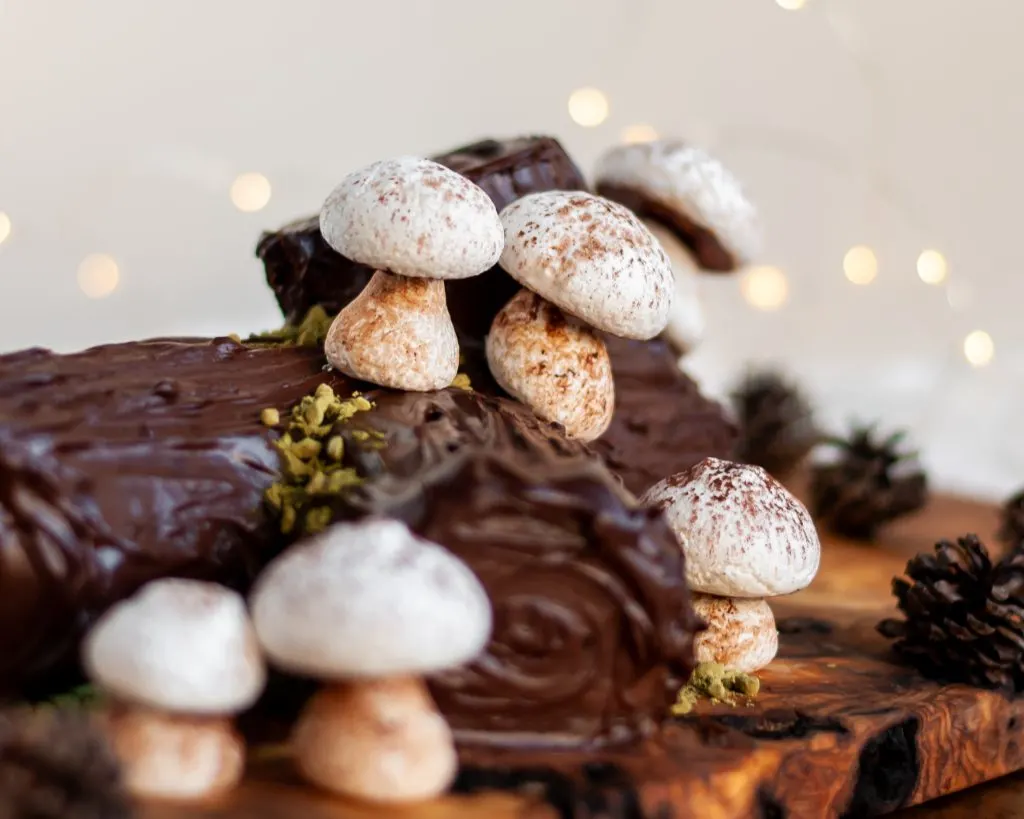 Vegan Meringue Mushrooms on a Vegan Chocolate Yule Log