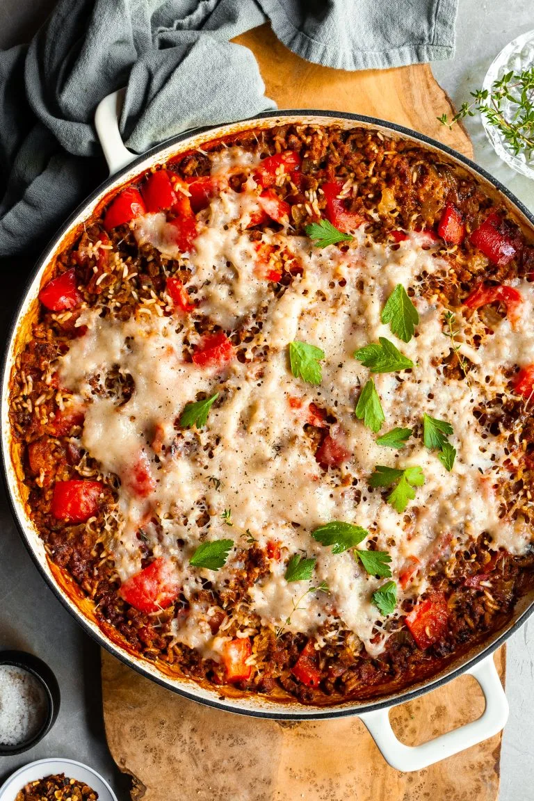 White baking dish of unstuffed peppers