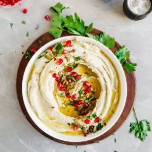 Roasted Pumkin Seed Hummus served with pomengrante seeds, olive oil drizzle and fresh parsley