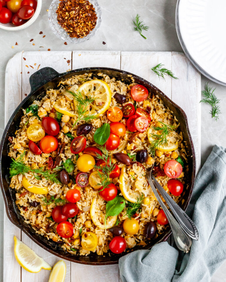 One-Skillet Baked Greek Lemon Chickpea and Rice ready to be served on white plates