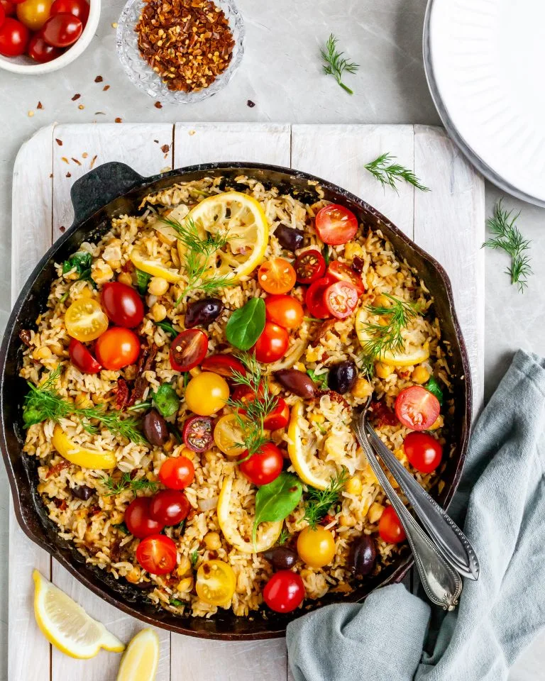 One-Skillet Baked Greek Lemon Chickpea and Rice ready to be served on white plates