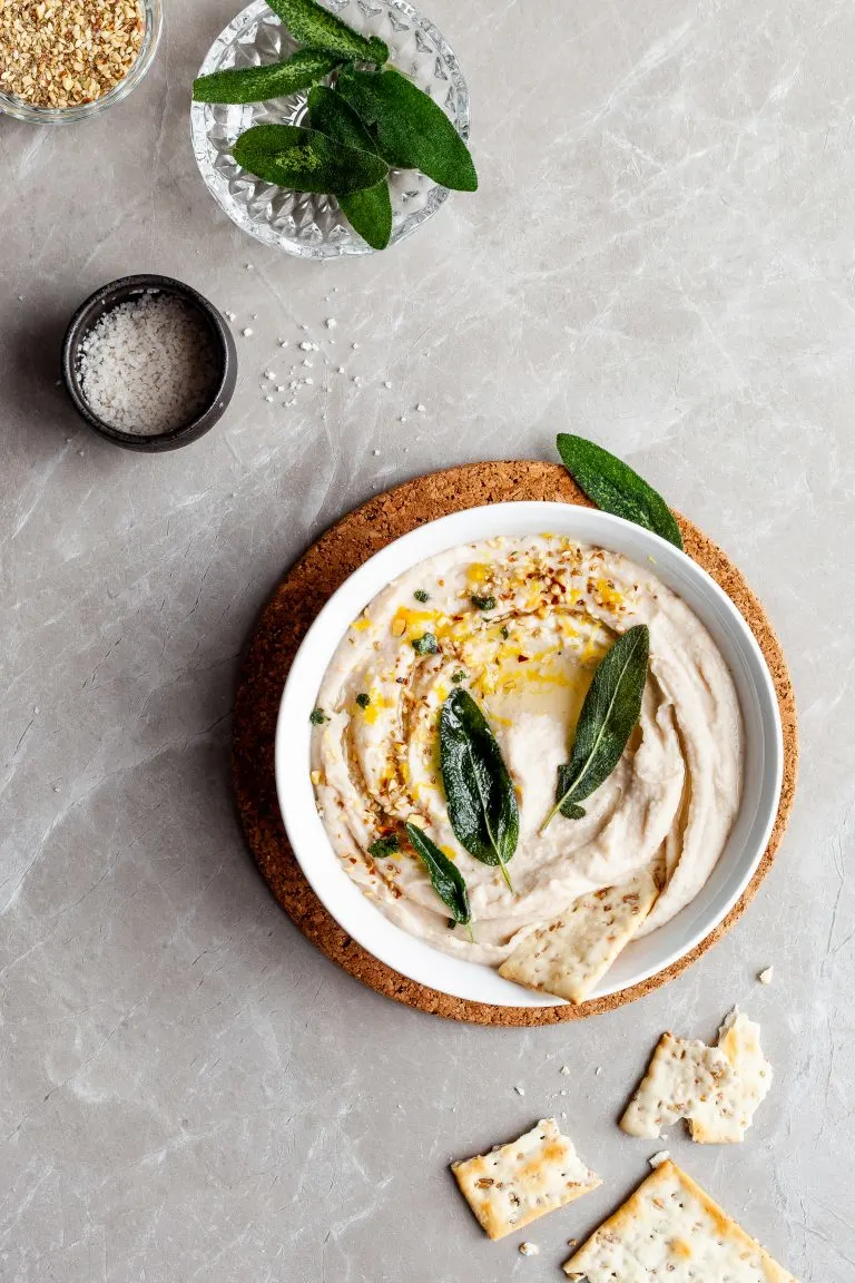 Lemon Sage White Bean Dip garnished with fried sage leaves
