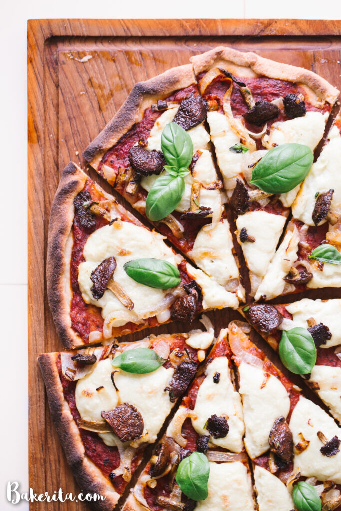 vegan gluten free pizza topped with mushrooms and onions