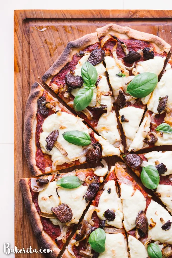 vegan gluten free pizza topped with mushrooms and onions