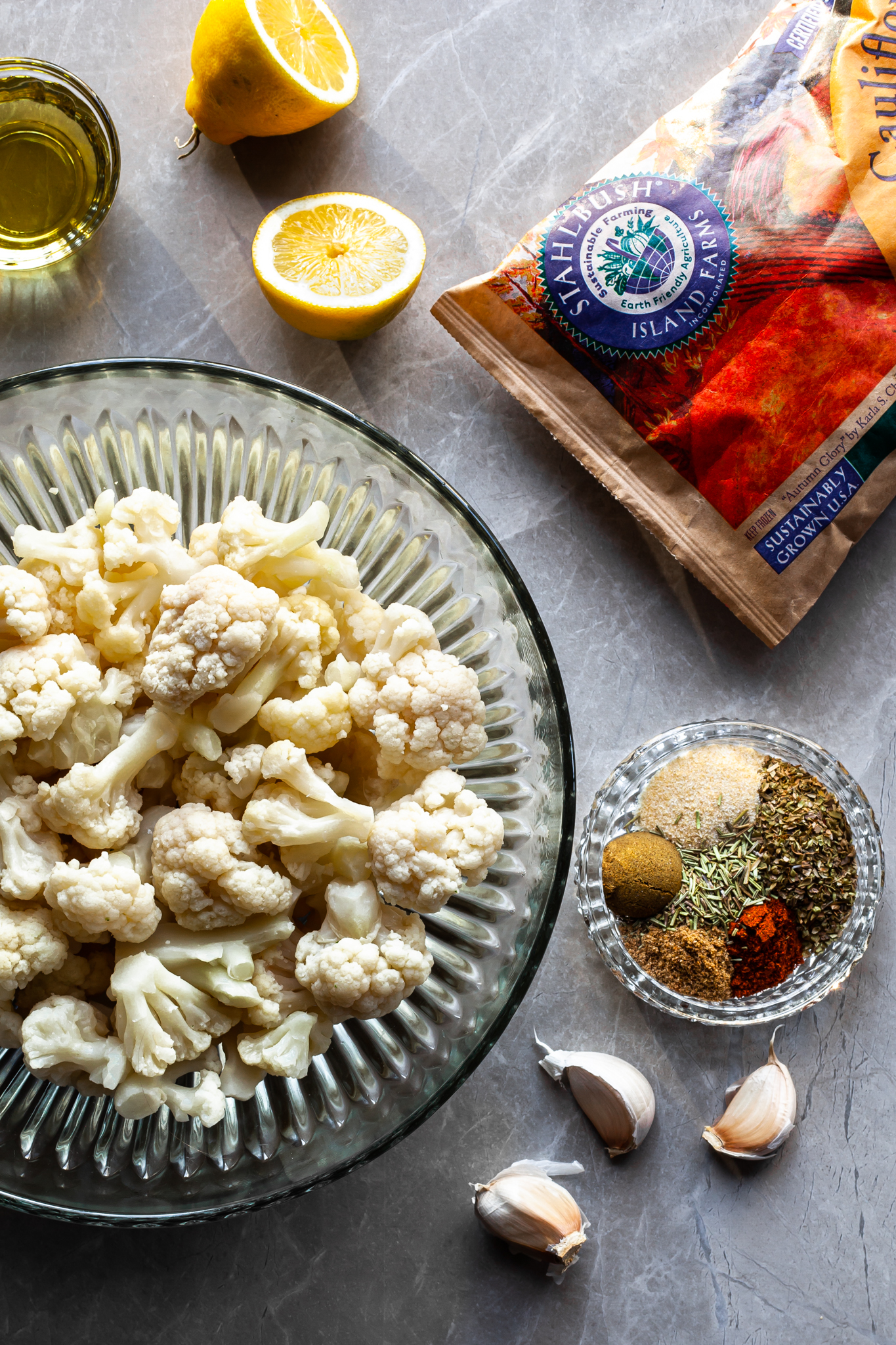 flat lay of the ingredients for the gyro marinade plus a bowl of cauliflower