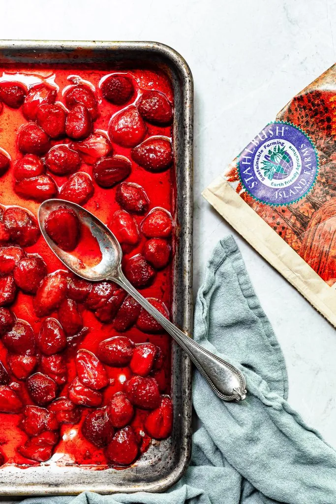 A baking sheet covered in roasted strawberries