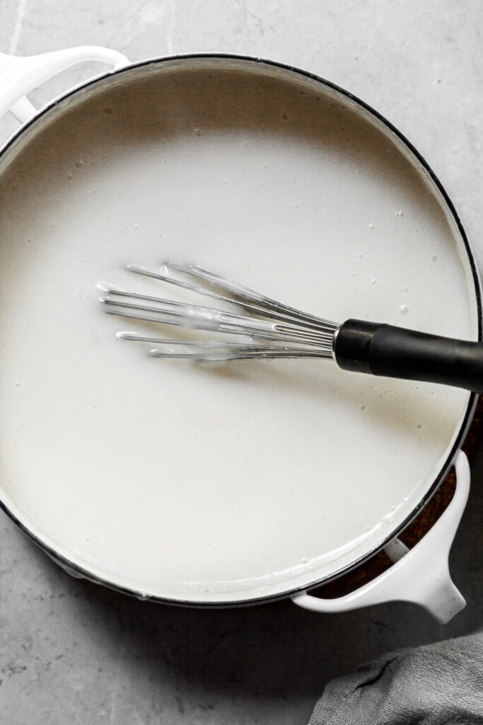 A white pot filled with a creamy white custard
