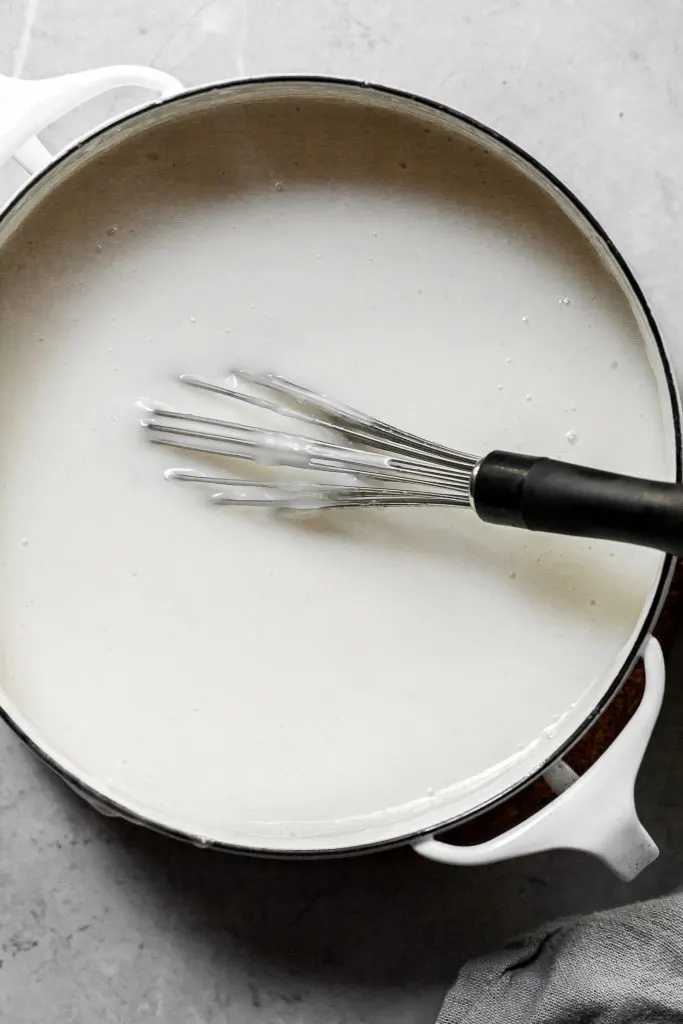 A white pot filled with a creamy white custard