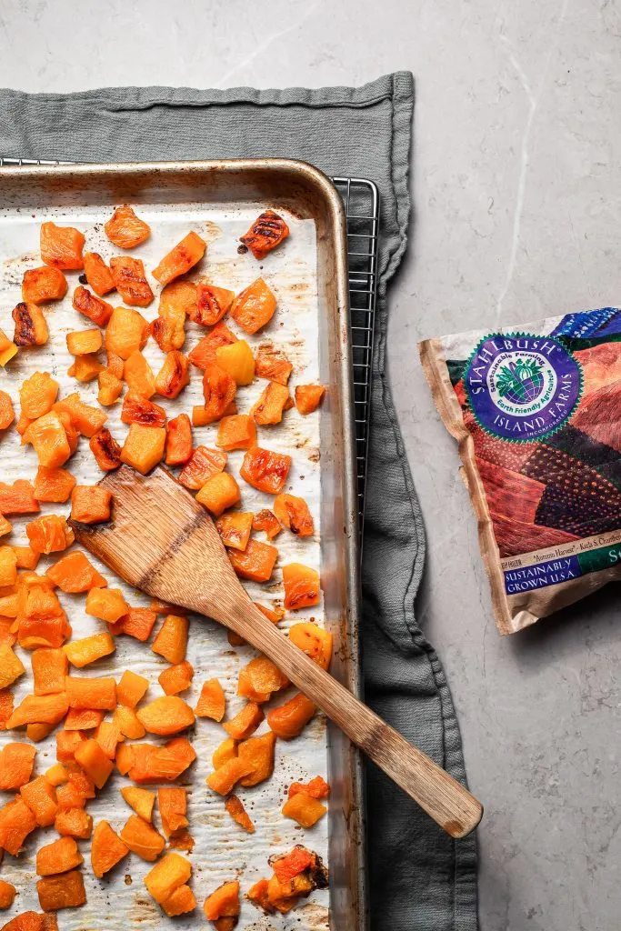A baking sheet covered in roasted butternut squash