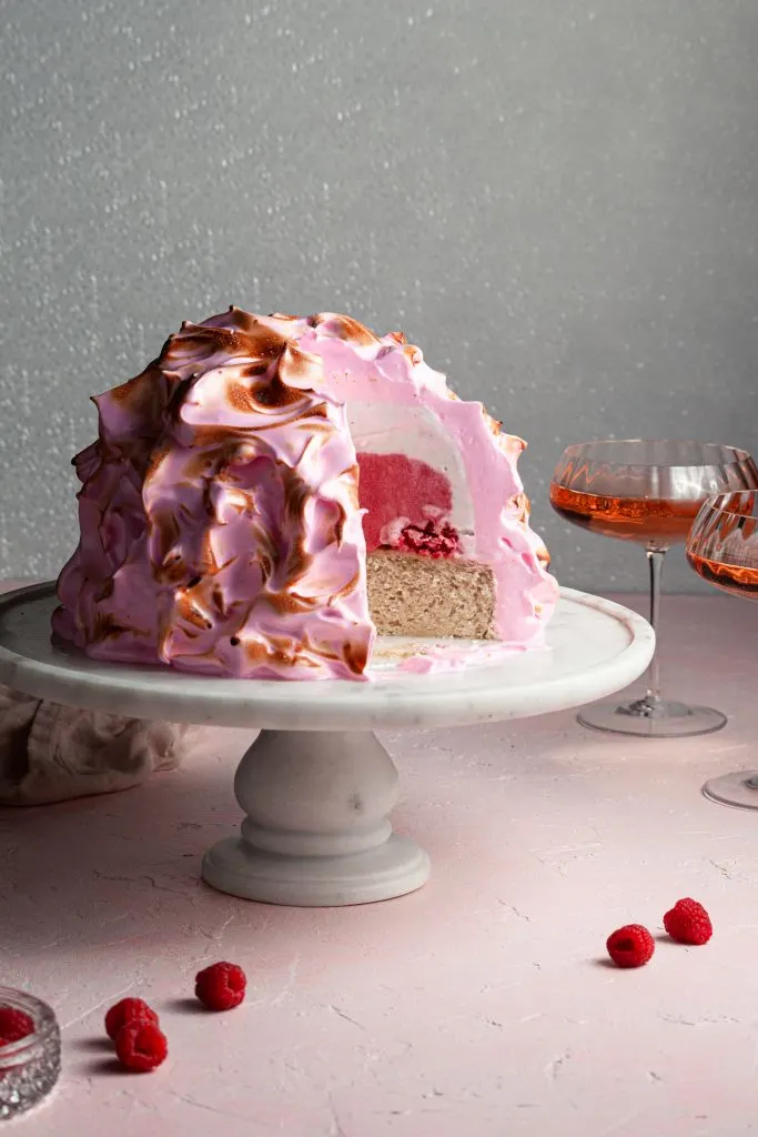 Pink baked alaska with a pink and white ice cream filling