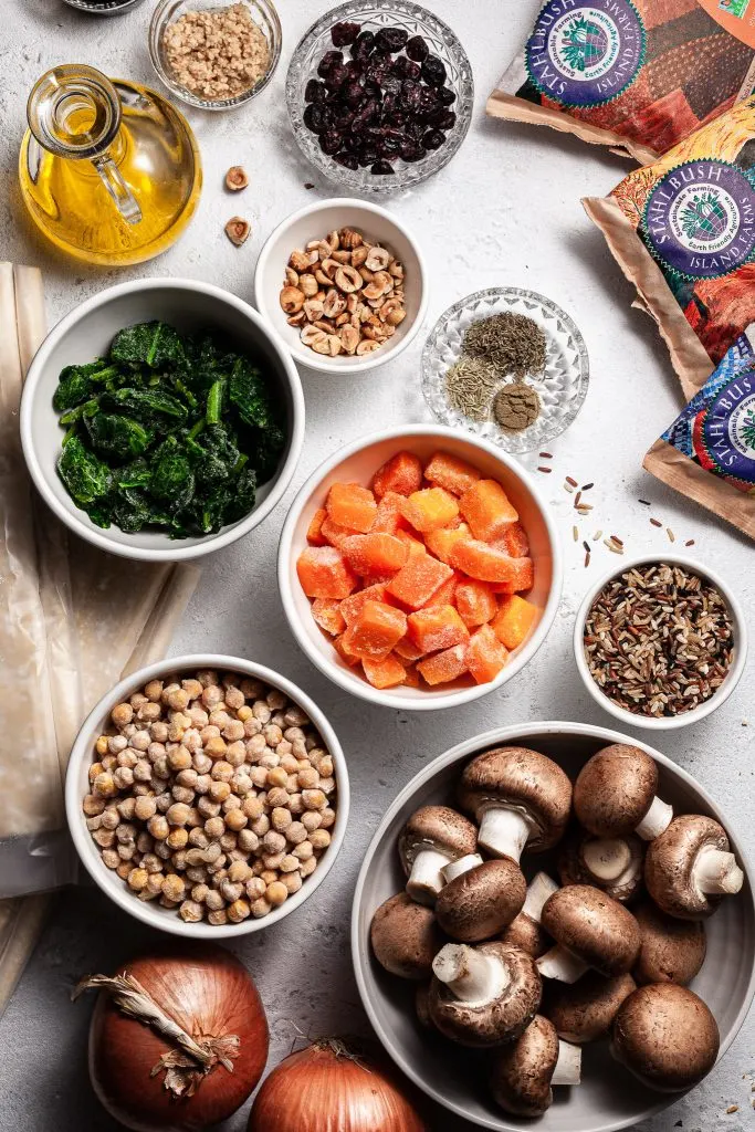 Ingredients measured out in bowls on a white countertop