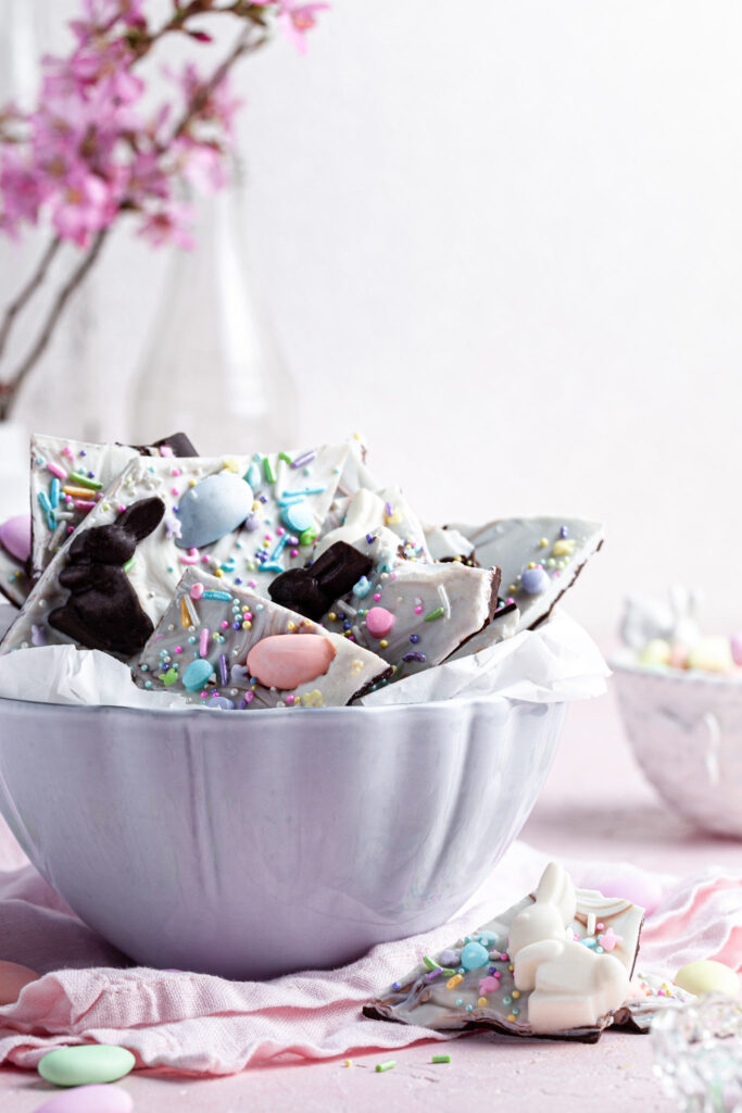 Close up of a white bowl filled with chocolate bark.