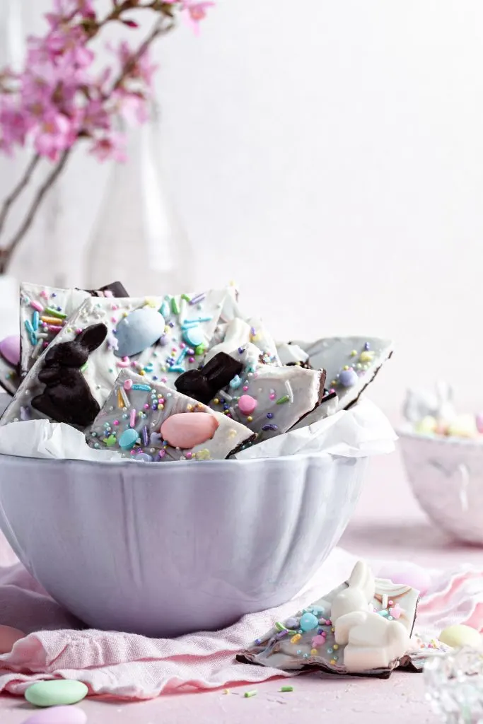 Close up of a white bowl filled with chocolate bark.