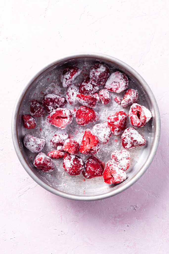 Step 1: A baking dish containing strawberries tossed in cornstarch. 