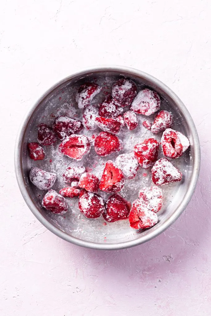 Step 1: A baking dish containing strawberries tossed in cornstarch. 
