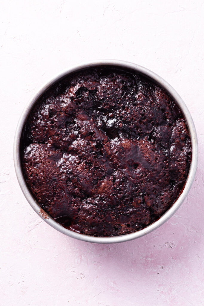 A baking dish filled with the freshly baked self-saucing chocolate strawberry pudding. 