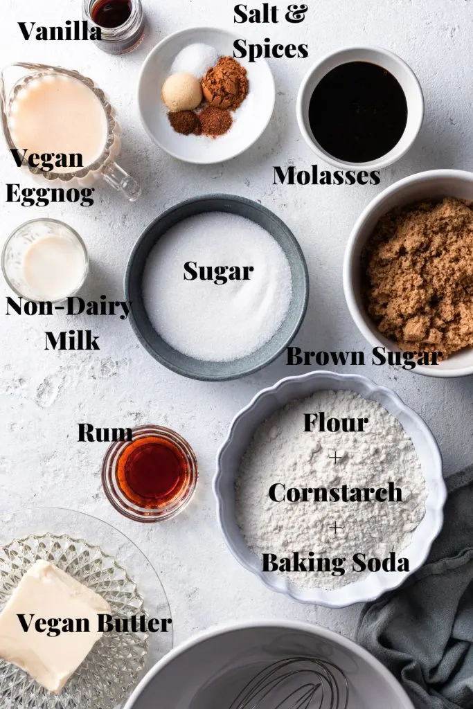 Ingredients measured out in bowls for the molasses cookies and the eggnog buttercream