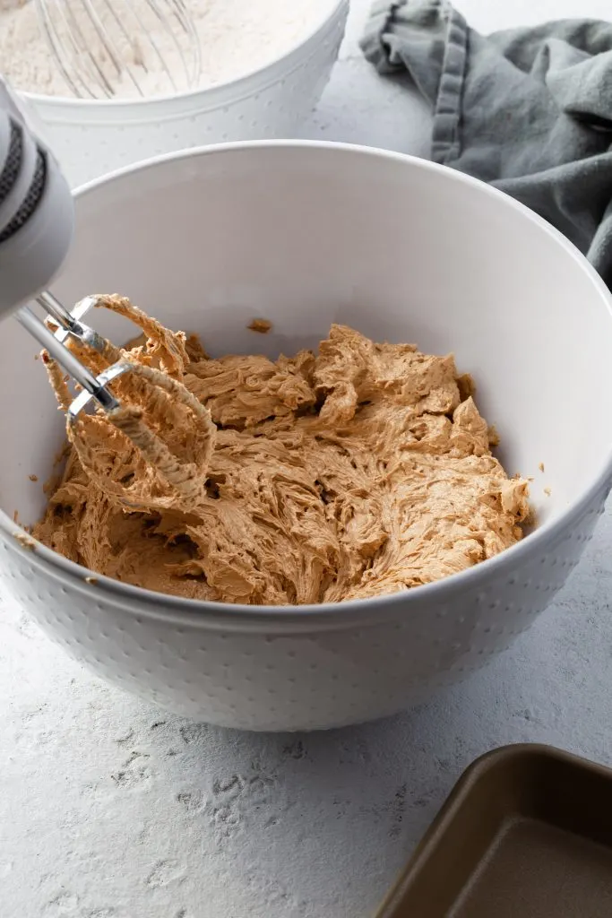 Whipped vegan butter, brown sugar and molasses for the molasses cookies