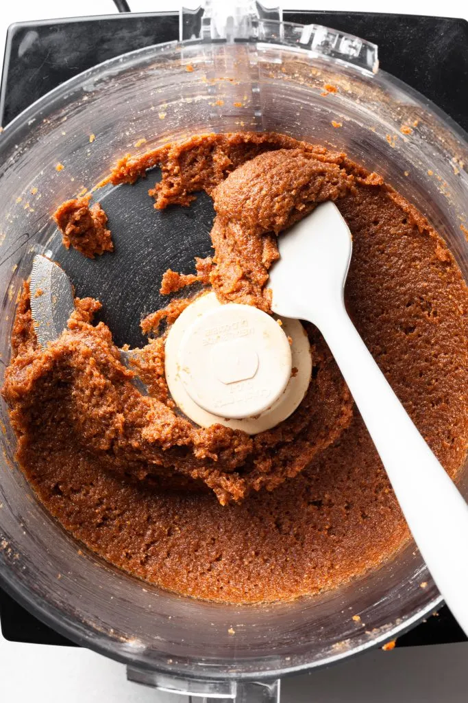 A food processor containing a fig paste. 