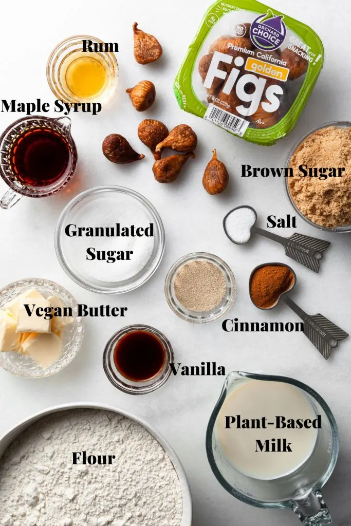The ingredients needed for this sticky bun recipe measured out on a white marble counter. 