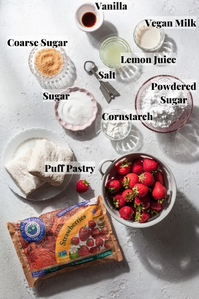 The ingredients needed for making vegan strawberry turnovers, all measured out on a white counter.
