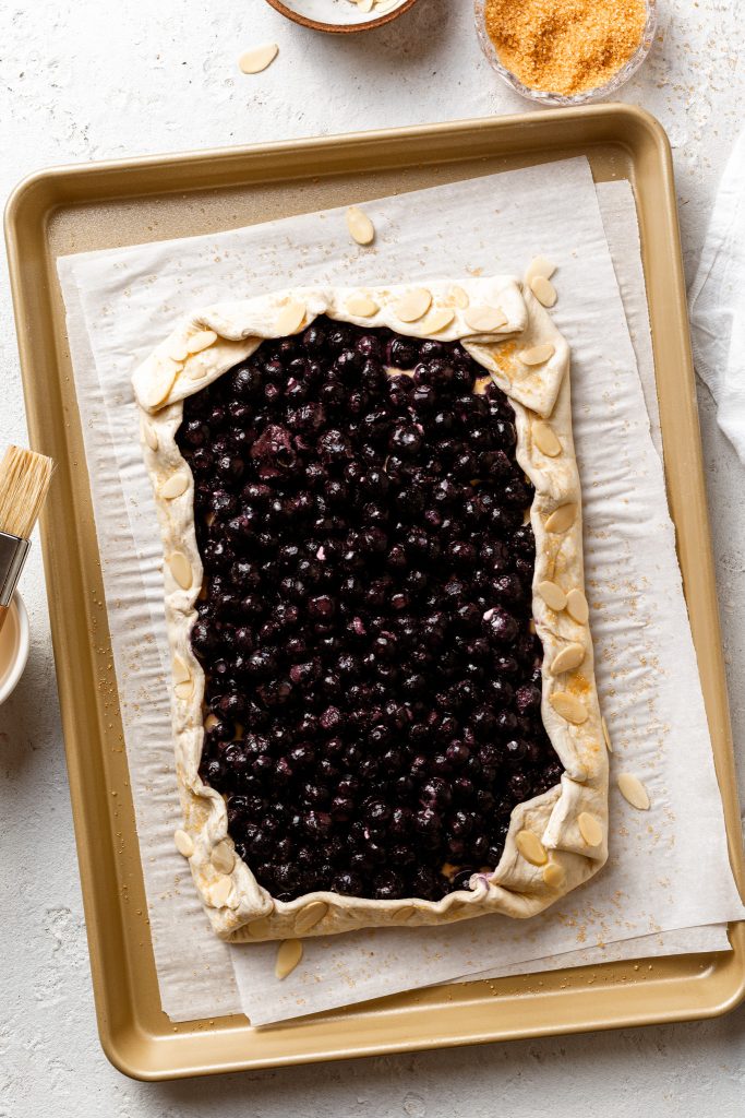 Assembled tart on a baking sheet prior to baking. 