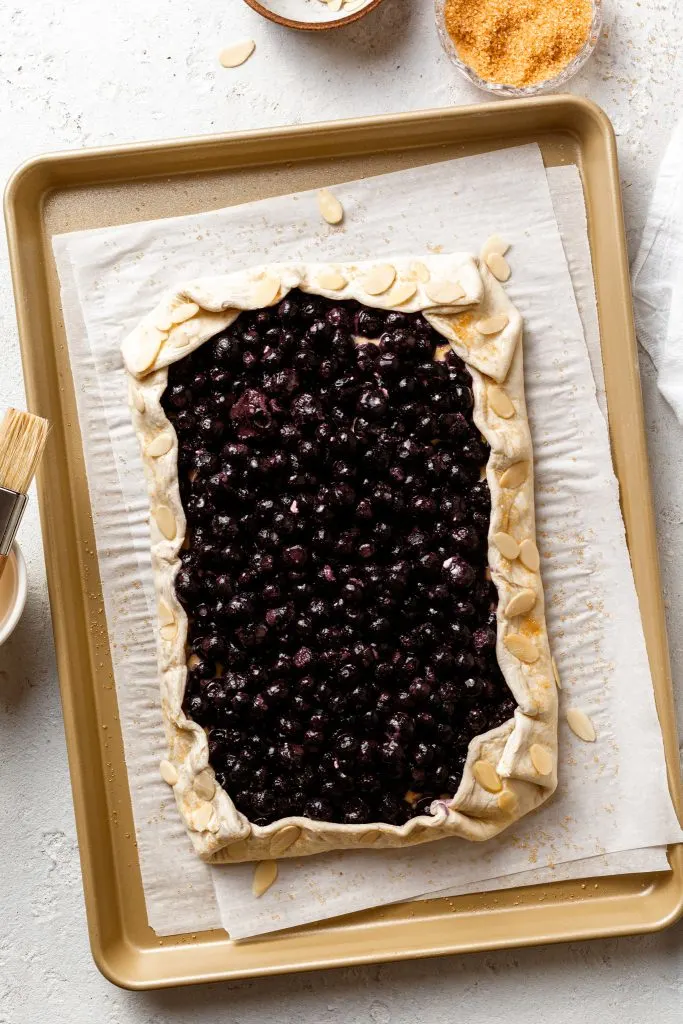 Assembled tart on a baking sheet prior to baking. 