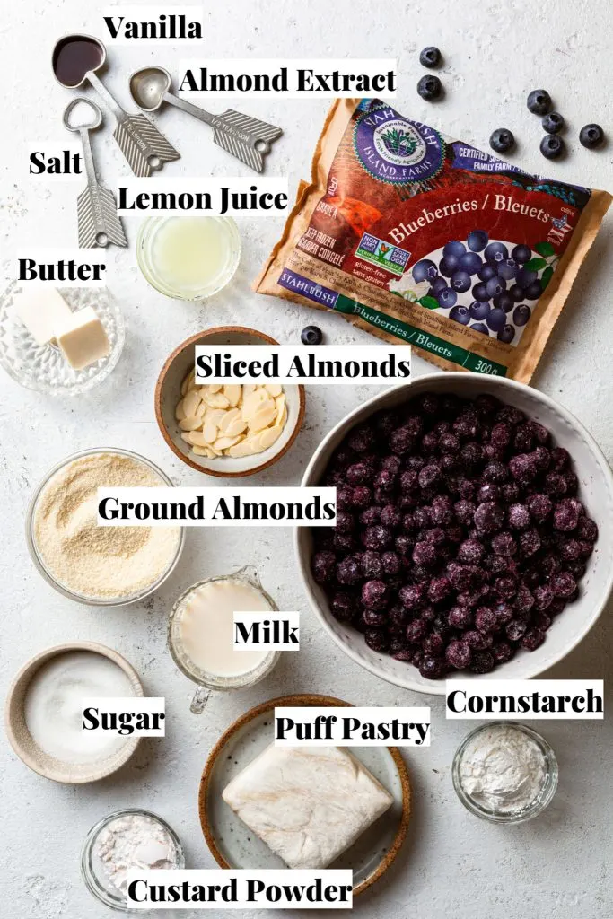 Baking ingredients measured out in bowls on a white countertop. 