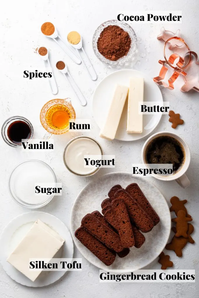 Ingredients measured out in spoons and bowls on a white counter top. 